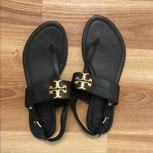 Tory Burch Black and Gold Sandals with Logo Medallion